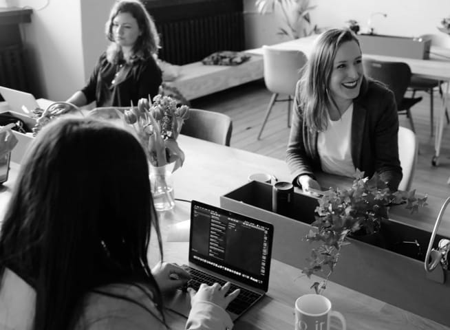 Photo of three women discussing